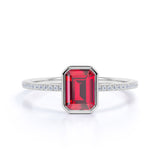 Classic Bezel Set 1.25 Carat Emerald Cut Lab Ruby and Micro Pave Diamond Engagement Ring in White Gold
