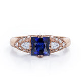 Vintage Eight Prongs 1.30 Carat Princess Cut Sapphire And Diamond Marquise Framed Beaded Engagement Ring In Rose Gold