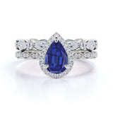 Stylish Art Deco Pave Set 2.25 Carat Pear Cut Sapphire and Diamond Halo Wedding Set with Eternity Band in White Gold