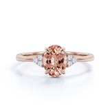 Prong Set 1.20 Carat Oval Cut Morganite and Six Stone Diamond Engagement Ring in Rose Gold