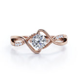 Modern Twisted 0.55 carat Round Moissanite and Diamond Infinity Engagement Ring in Rose Gold