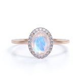 Antique 1.25 Carat Oval Cabochon Cut Blue Moonstone and Diamond Halo Engagement Ring in White Gold