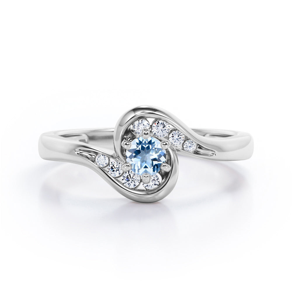Whirly Gemstone 0.55 carat Round Aquamarine and Moissanites Artistic Engagement Ring in Rose Gold