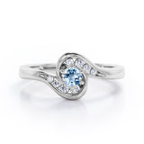 Whirly Gemstone 0.55 carat Round Aquamarine and Moissanites Artistic Engagement Ring in Rose Gold