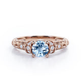 Unique Four Prong 1.15 Carat Round Cut Aquamarine And Diamond Art Deco Engagement Ring In White Gold