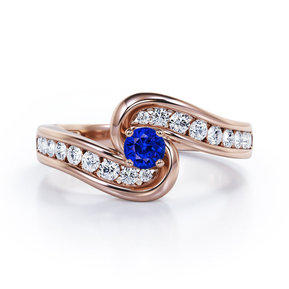 Spinning 0.7 carat Round Blue Sapphire and Moissanite Channel Engagement Ring in White Gold