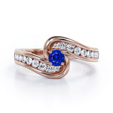Spinning 0.7 carat Round Blue Sapphire and Moissanite Channel Engagement Ring in White Gold