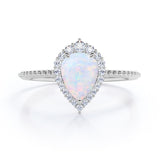 Vintage Inspired 1.35 Carat Tear Drop Fiery White Opal And Diamond Halo Engagement Ring In White Gold