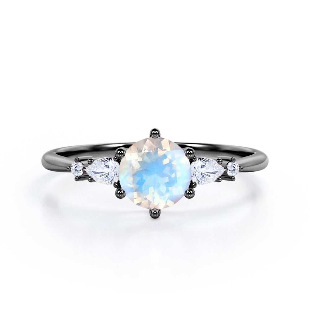 Balancing 5 stones 0.55 carat Round Moonstone and Moissanite Engagement Ring in Rose Gold