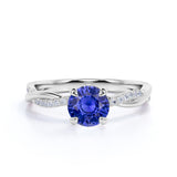 Infinity Style 1.25 Carat Round Cut Sapphire and Diamond Engagement Ring in White Gold