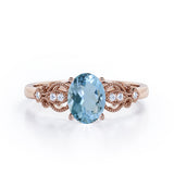 Swirly 0.5 carat Oval Aquamarine and Diamonds Antique Engagement Ring in Rose Gold