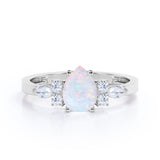 Four Prong Basket Set 1.35 Carat Pear Cut Ethiopian Opal And Diamond Seven Stone Engagement Ring In White Gold