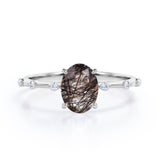 Sharp Four Claws 1.10 Carat Oval Cut Natural Black Rutilated Quartz And Diamond Seven Stone Engagement Ring In White Gold