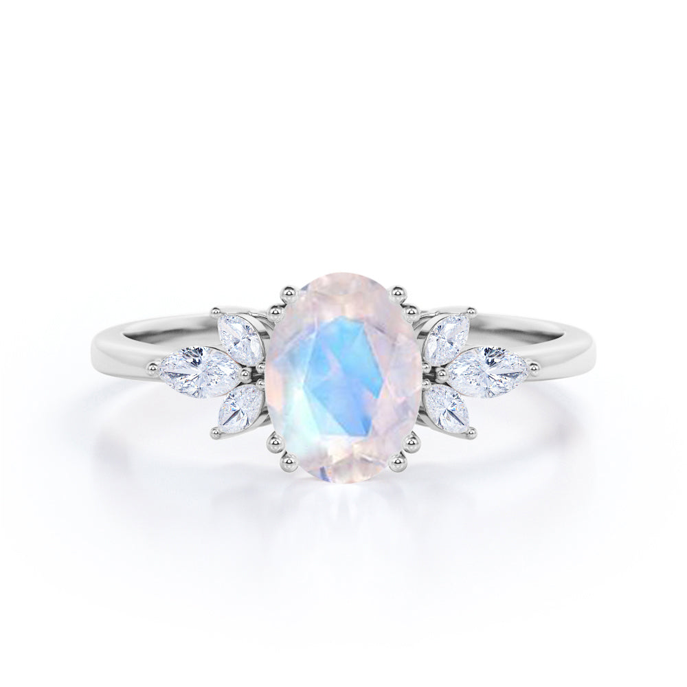 Seven Stone Nature-Inspired 1.10 carat Oval Moonstone and Moissanite Engagement Ring in Rose Gold