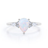 Affordable 1.35 Carat Tear Drop White Opal And Diamond  Seven Stone Engagement Ring In White Gold.