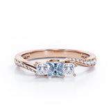 Scale Bridge Accent 0.65 carat Princess Aquamarine and Moissanite Twisted Wave Engagement Ring in Rose Gold