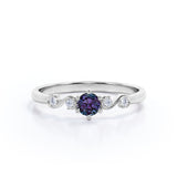 Classic Six Prong 1.10 Carat Round Cut Lab Created Alexandrite And Diamond Five Stone Engagement Ring In White Gold.