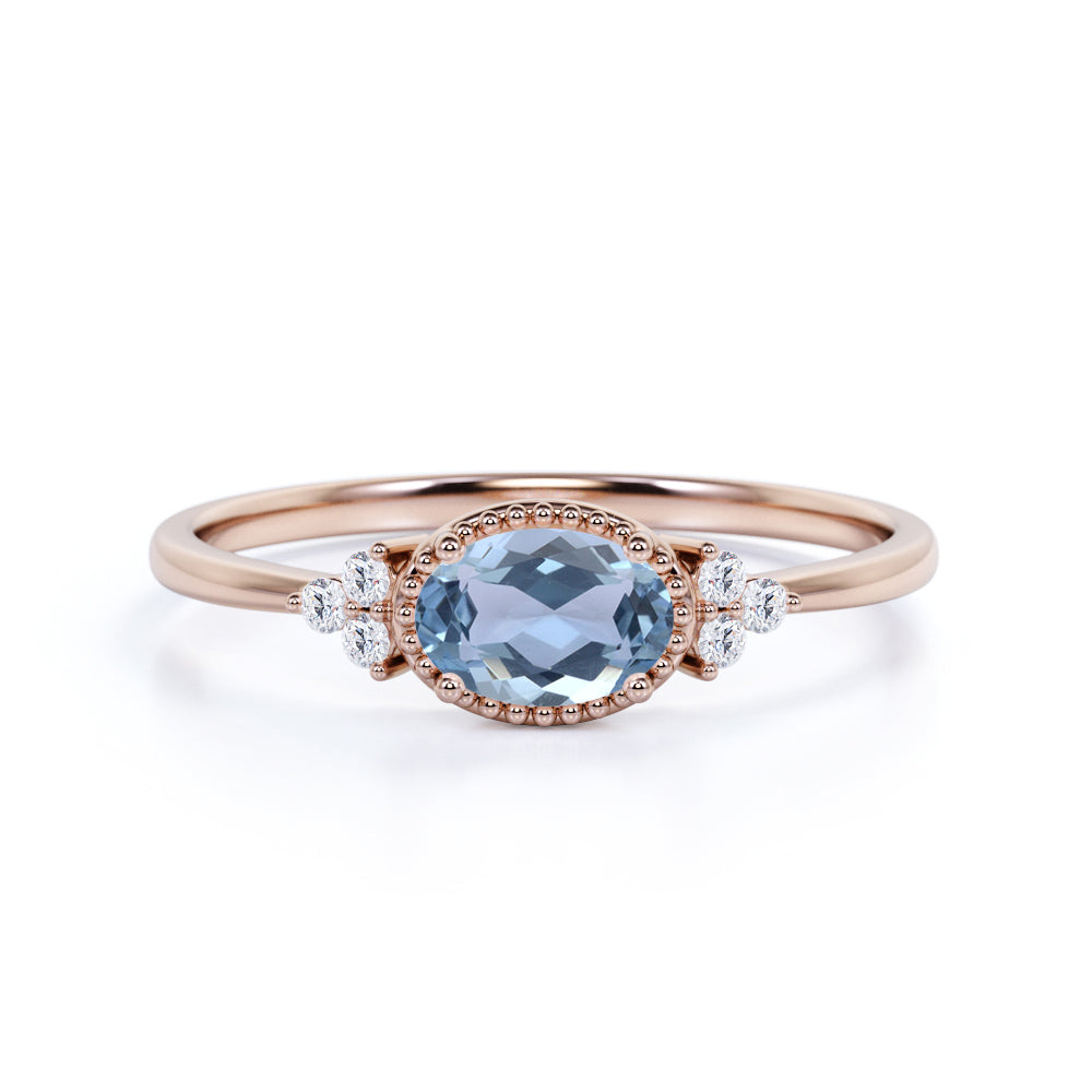 Unique East West 1.40 Carat Oval Cut Aquamarine and 7 Stone Diamond Engagement Ring in White Gold