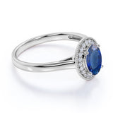 Antique 1.50 Carat Oval cut Sapphire and Diamond Halo Engagement Ring in White Gold