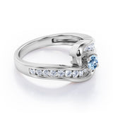 Spinning 0.7 carat Round Aquamarine and Moissanite Channel Engagement Ring in White Gold