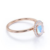 Antique 1.25 Carat Oval Cabochon Cut Blue Moonstone and Diamond Halo Engagement Ring in White Gold
