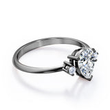 Minimalist Three Stone 0.55 carat Pear Moissanite and Diamond Engagement Ring in Rose Gold