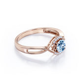 Modern Halo 1.50 Carat Round Cut Vivid Blue Aquamarine and Diamond Heart Twist Engagement Ring