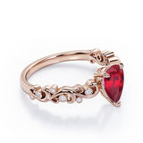 Vintage Style Scroll 0.5 carat Pear Lab Ruby and Diamond Engagement Ring in Rose Gold