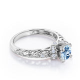 Unique Four Prong 1.15 Carat Round Cut Aquamarine And Diamond Art Deco Engagement Ring In White Gold