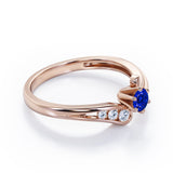 Curved Band - Six Prongs 0.5 carat Round Blue Sapphire and Moissanite Artistic Engagement Ring in Rose Gold