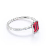 Classic Bezel Set 1.25 Carat Emerald Cut Lab Ruby and Micro Pave Diamond Engagement Ring in White Gold