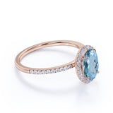1.25 Carat oval cut Aquamarine and Diamond Halo Wedding Ring in Rose Gold