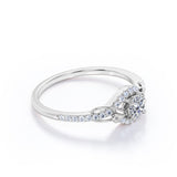 Swirl Halo 1 Carat Round Colorless Moissanite and Diamond French Pave Engagement Ring in Rose Gold