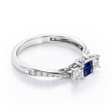 Scale Bridge Accent 0.65 carat Princess Blue Sapphire and Moissanite Twisted Wave Engagement Ring in Rose Gold