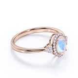 Vintage 1.50 Carat Oval Cut Blue Moonstone and Diamond Halo Engagement Ring in White Gold