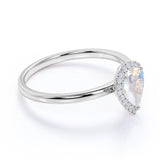 Elegant 1.25 Carat Pear Blue Moonstone and Diamond Pave Engagement Ring in Rose Gold