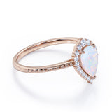 Vintage Inspired 1.35 Carat Tear Drop Fiery White Opal And Diamond Halo Engagement Ring In White Gold