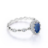 Vintage Art Deco 1.15 Carat Oval cut Blue Lab-Created Sapphire and Diamond Bezel Engagement Ring