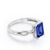 Solitaire 1 Carat Lab-Created Emerald Cut Sapphire Infinity Engagement Ring In White Gold