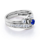 Twisted Tension - Prong 1 TCW Round Brilliant Cut Blue Sapphire and Moissanite - Flush Channel Wedding Set in White Gold