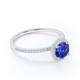 Pave Set 1.50 Carat Round Cut Sapphire and Diamond Halo Engagement Ring in White Gold