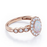 Vintage Floral Halo 0.7 carat Oval and Round Opal and diamond Engagement Ring in Rose Gold