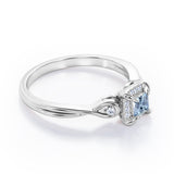 Prong and Halo 0.6 carat Princess Aquamarine and Moissanite Twisted Shank Engagement Ring in White Gold