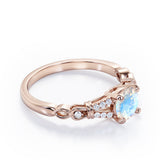 Split Shank 0.6 carat Round Moonstone and Diamond Engagement Ring in Rose Gold