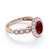 Vintage Floral Halo 0.7 carat Oval and Round Ruby and diamond Engagement Ring in Rose Gold
