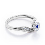 Floral Cloud Clustered 0.55 carat Round Blue Sapphire and Moissanite Distorted Engagement Ring in White Gold