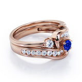 Twisted Tension - Prong 1 TCW Round Brilliant Cut Blue Sapphire and Moissanite - Flush Channel Wedding Set in White Gold