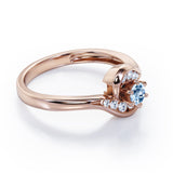 Whirly Gemstone 0.55 carat Round Aquamarine and Moissanites Artistic Engagement Ring in Rose Gold