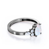 Four Prong Basket Set 1.35 Carat Pear Cut Ethiopian Opal And Diamond Seven Stone Engagement Ring In White Gold