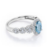 Twisted 1.45 Carat Oval Cut Aquamarine And Diamond Halo Engagement Ring In White Gold
